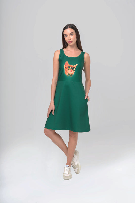 Woman wearing a green dress with a cat design